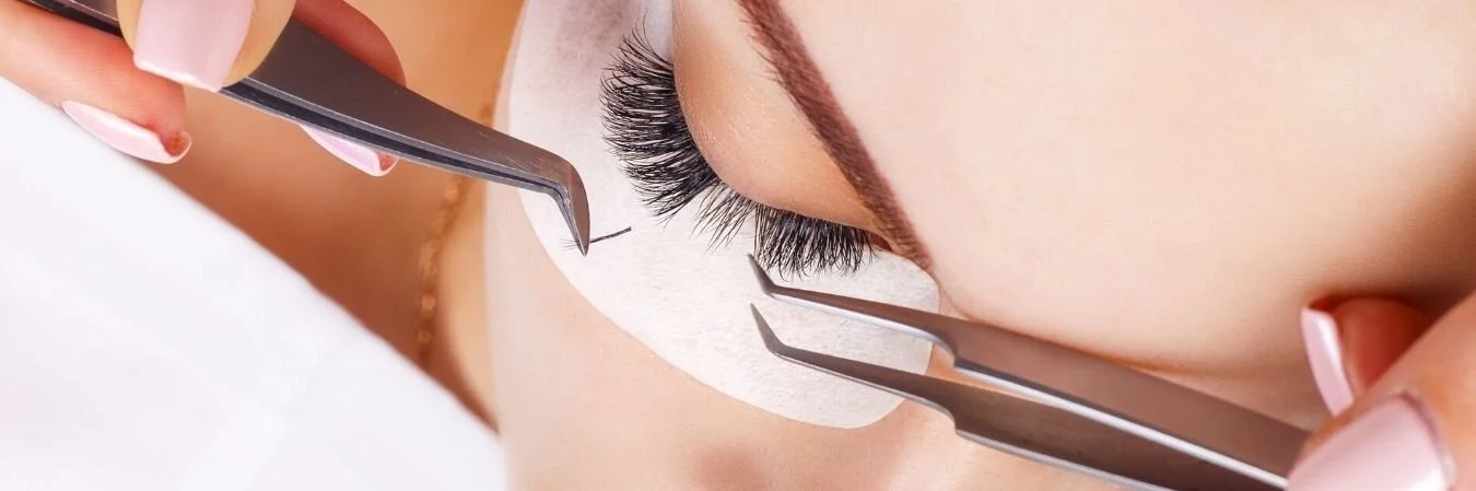 Hybrid lash extensions being applied at Dollface Beauty and Wellness in Oakville