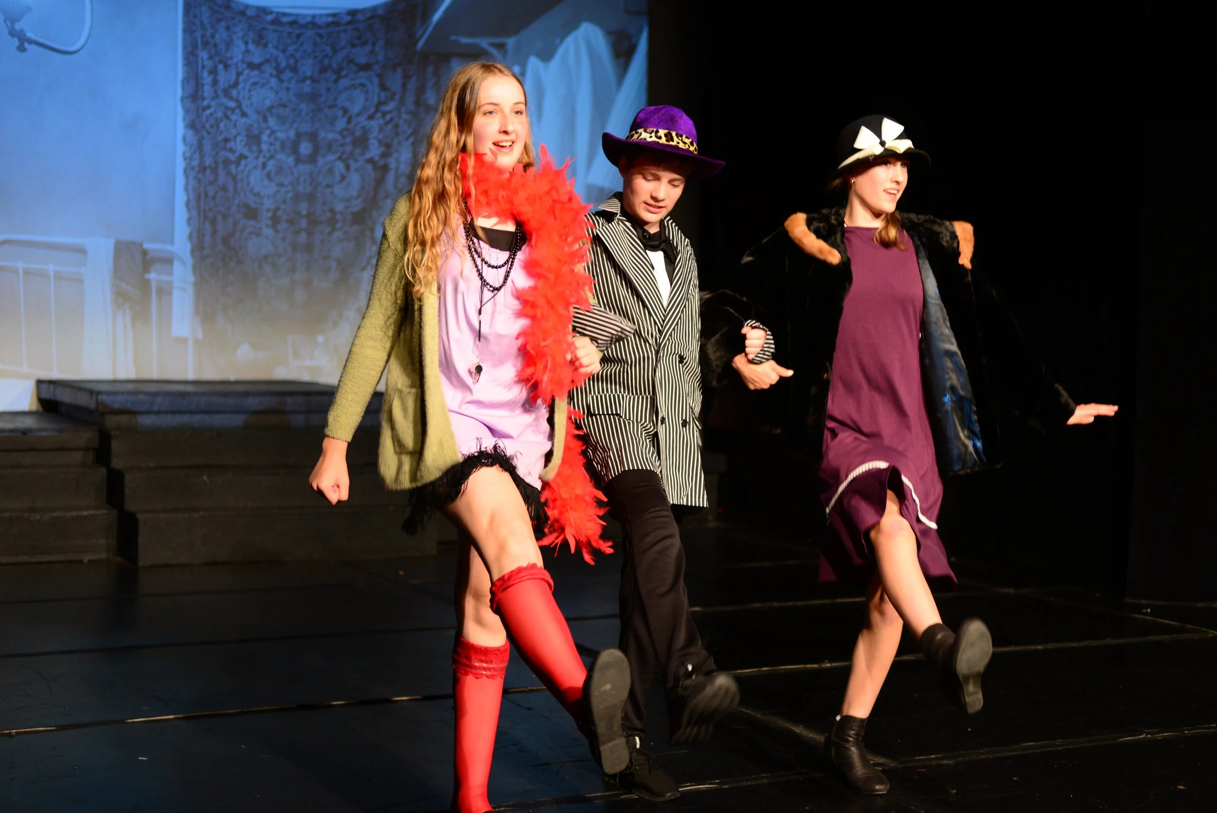 3 students dancing