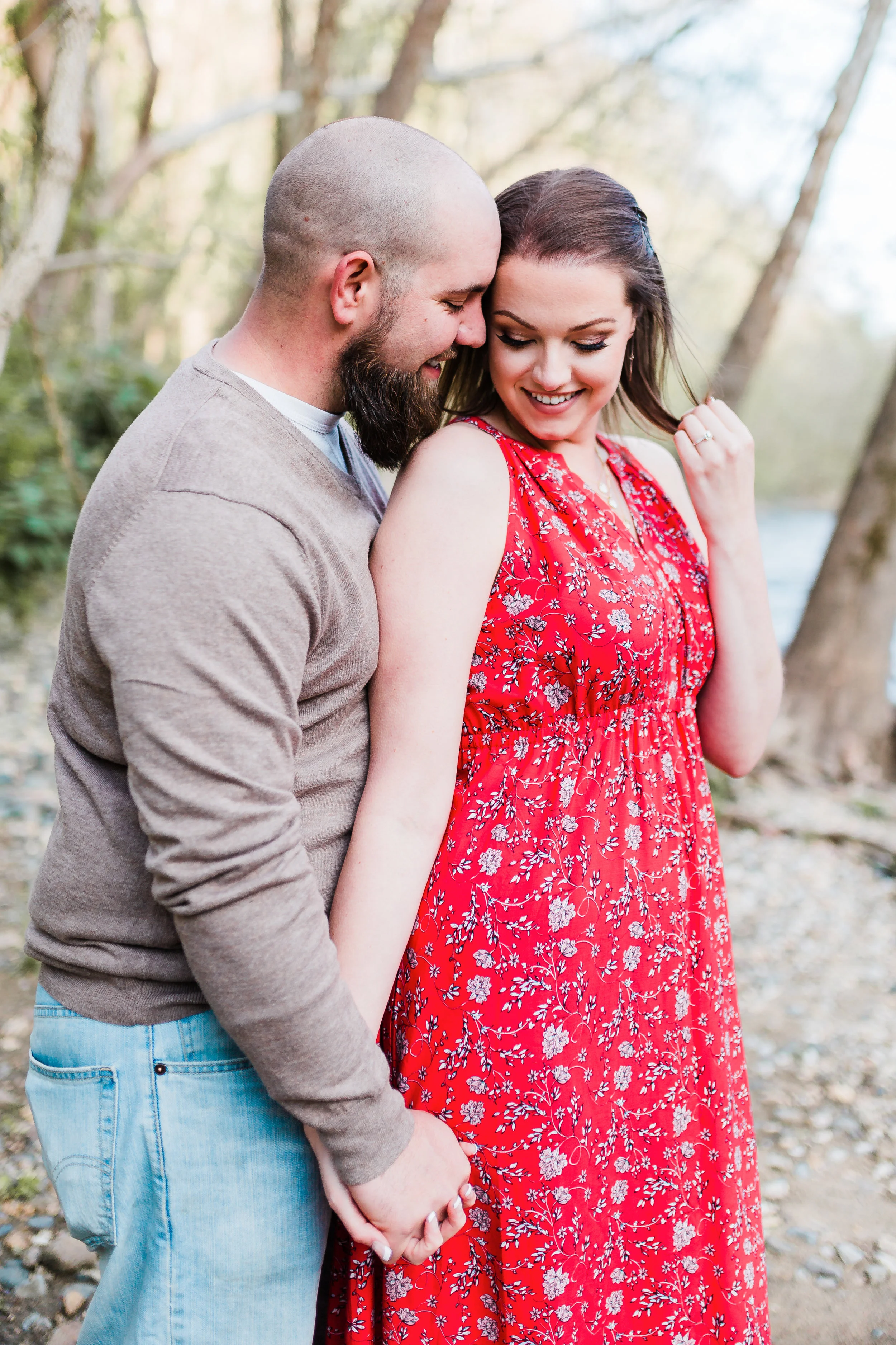 bride and groom pose together while laughing in maryland