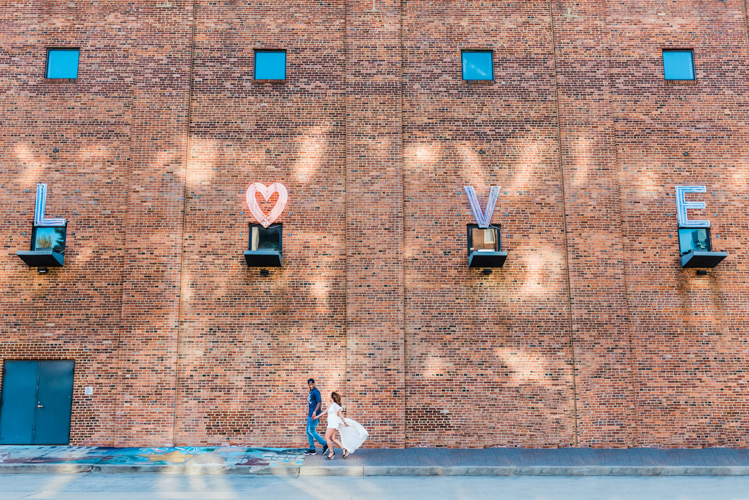 love sign in baltimore city during engagement session near federal hill