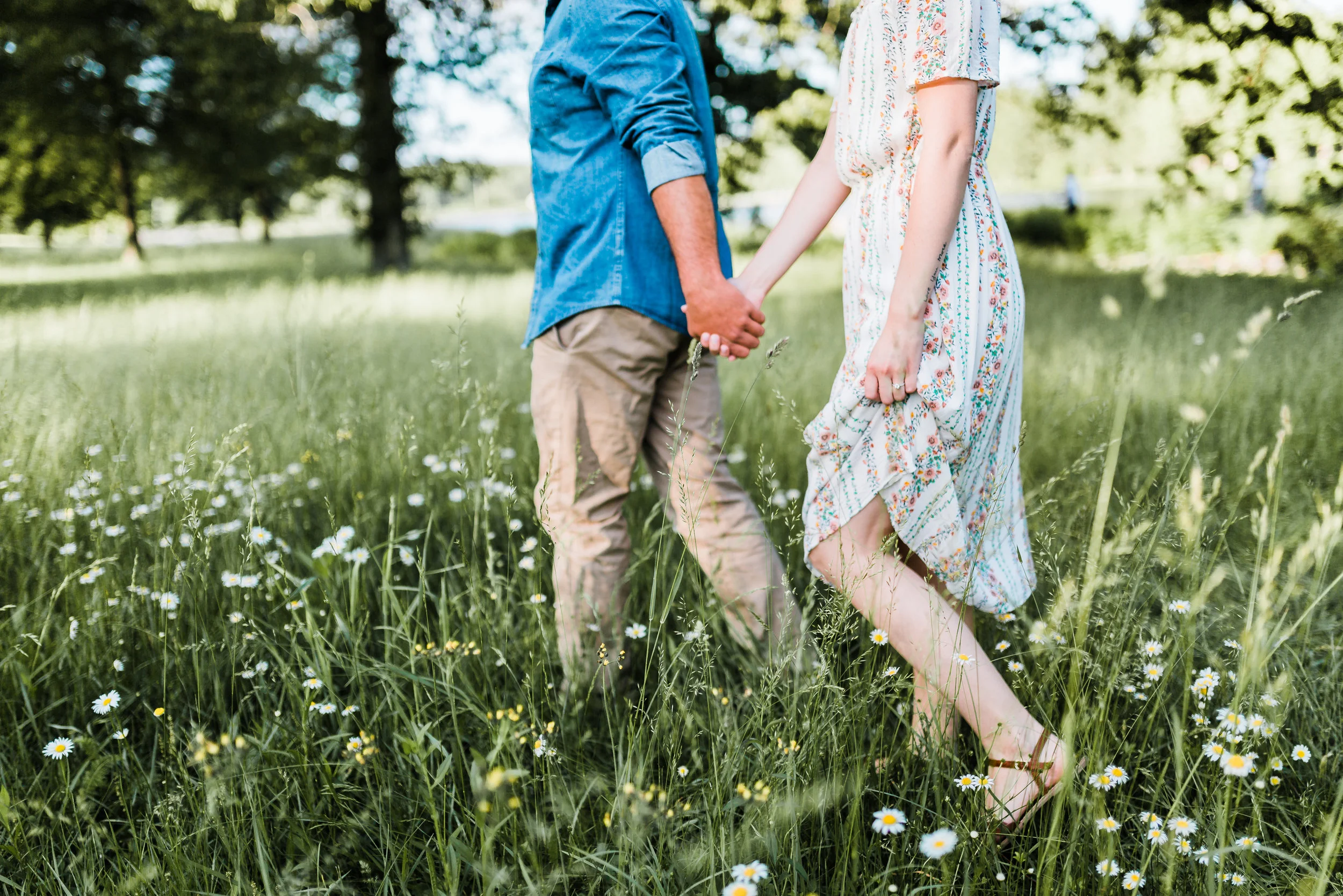 couple walking and holding hands - romantic maryland engagement session