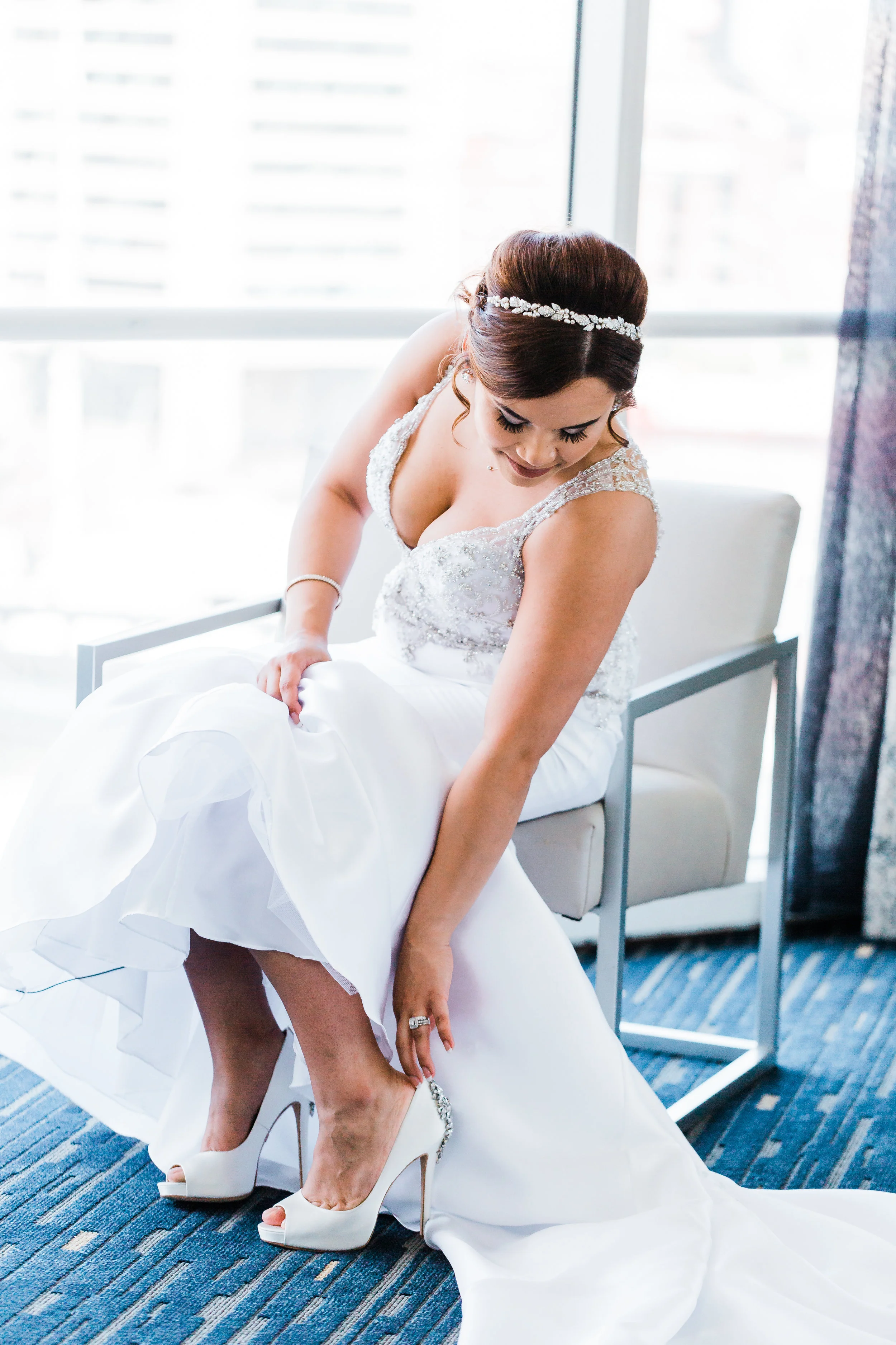 bride putting on her shoes in downtown baltimore