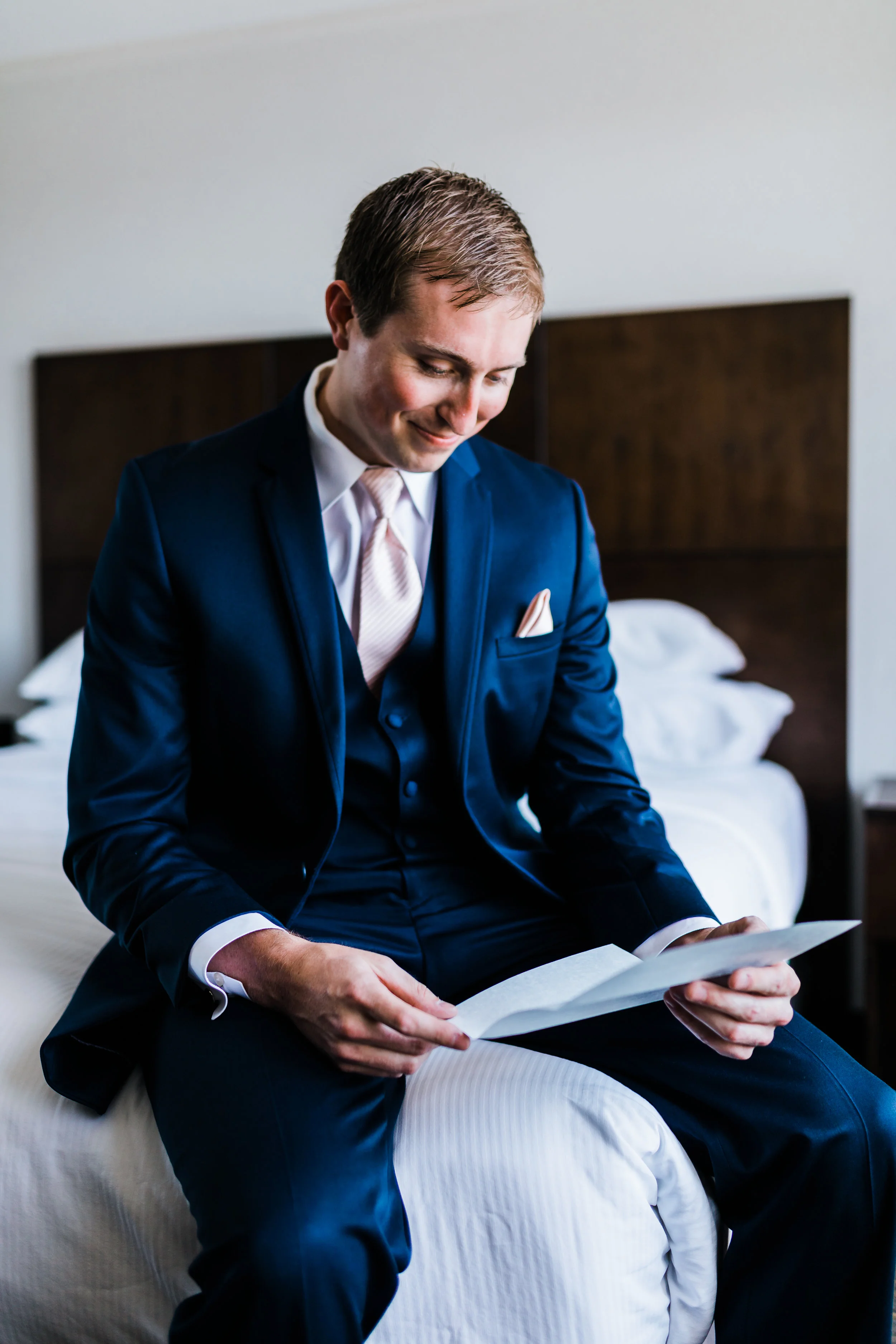 groom getting ready and reading his letter from his bride - md wedding - pasadena maryland