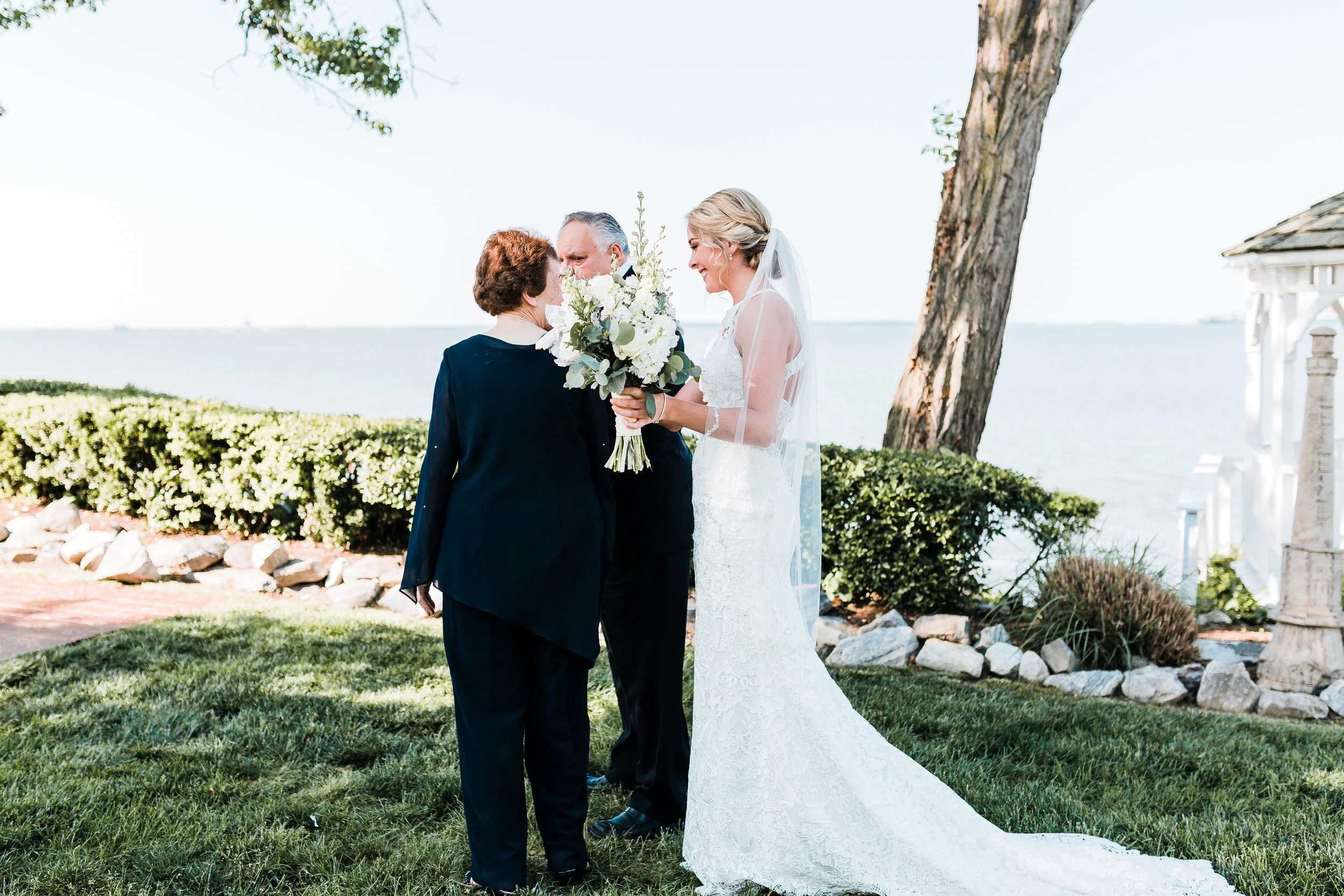 bride shares a first look with her grandparents at celebrations at the bay in pasadena md