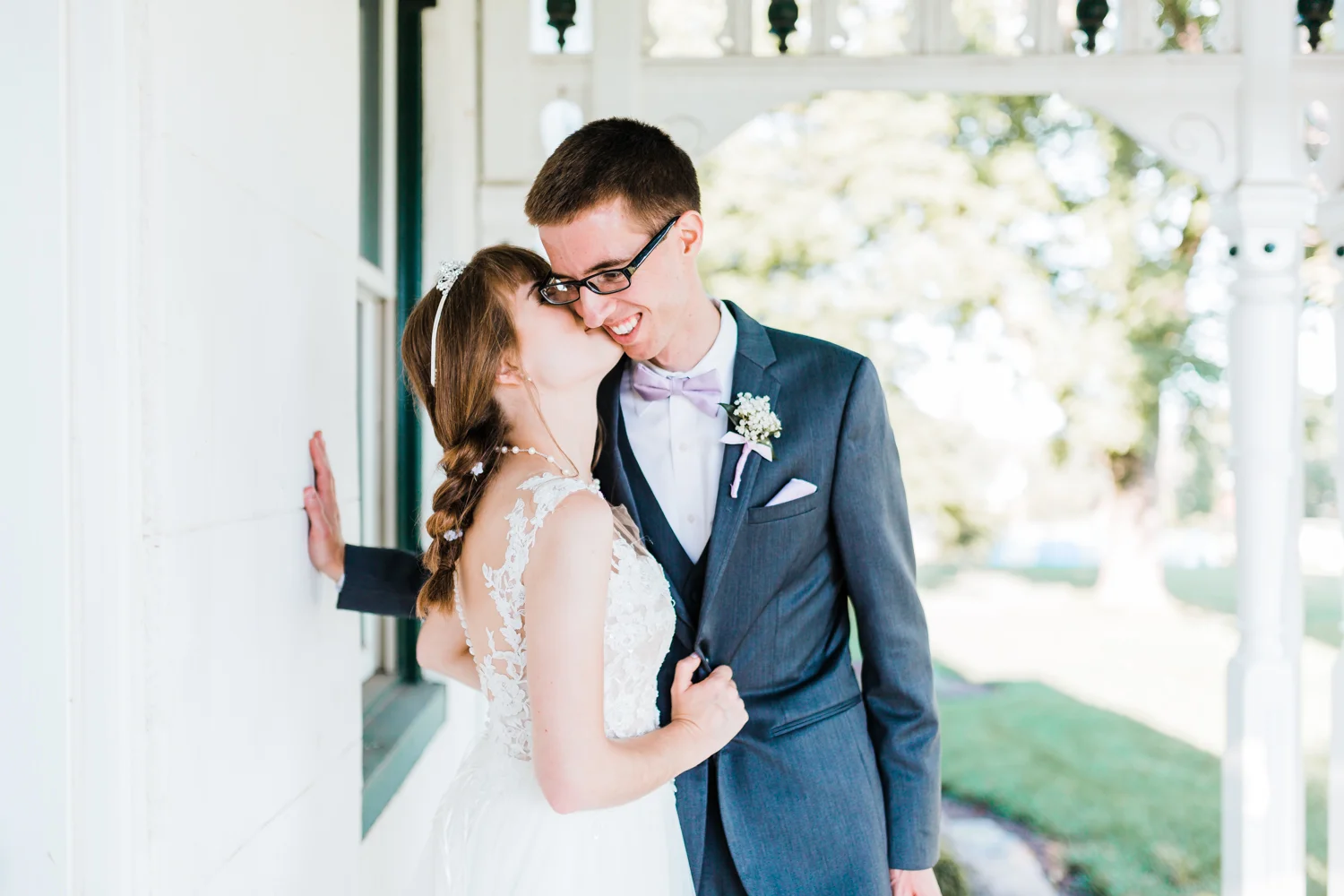 bride kissing her groom on the cheek in maryland wedding