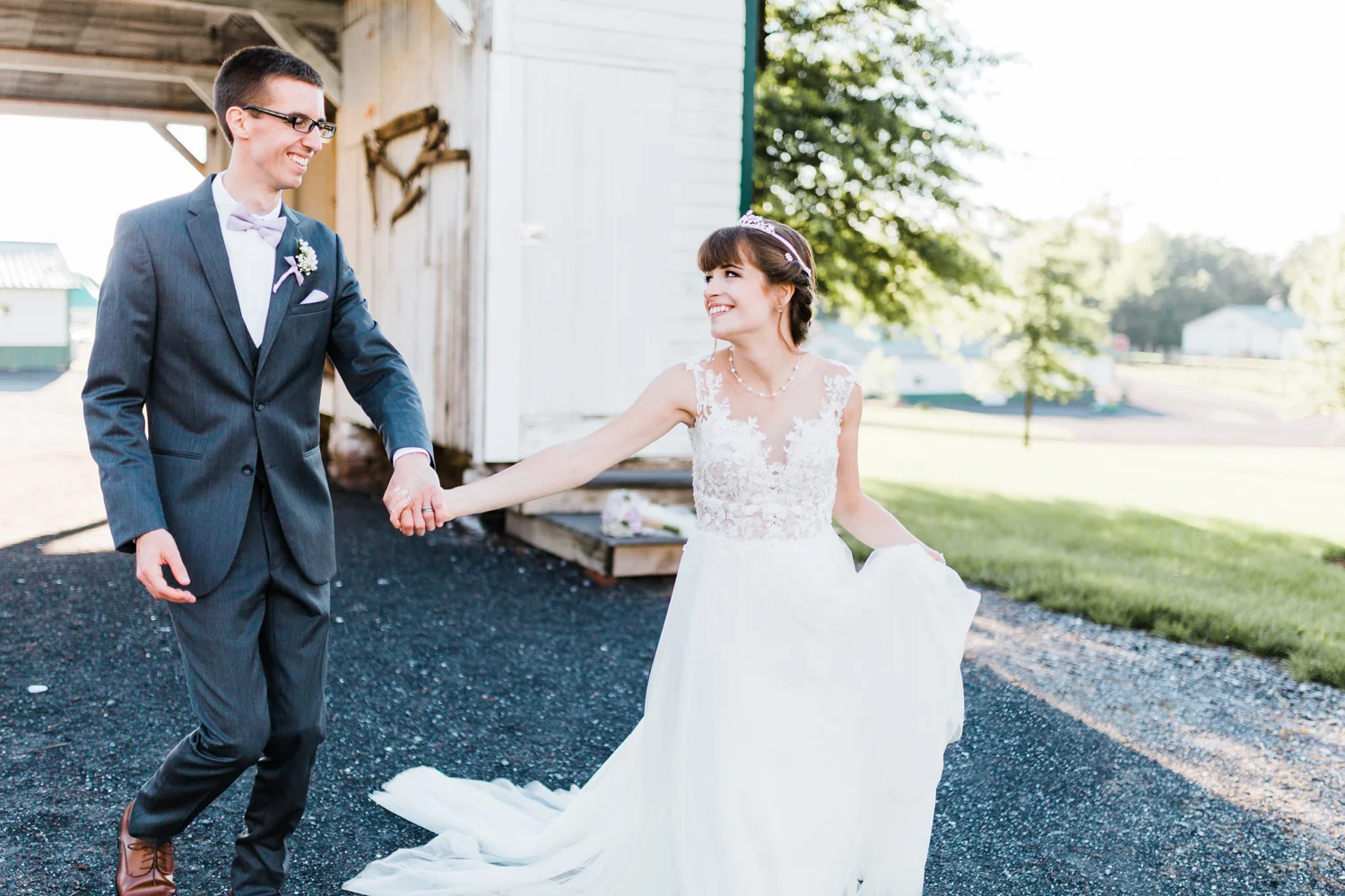bride and groom running together and having fun at their rustic maryland wedding - best md wedding photographer