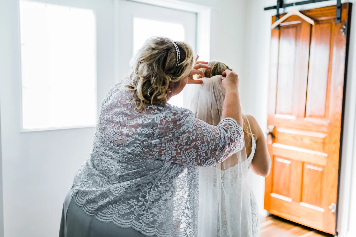 Bride’s Mom putting on her veil - 5 star wedding photo and video in Maryland