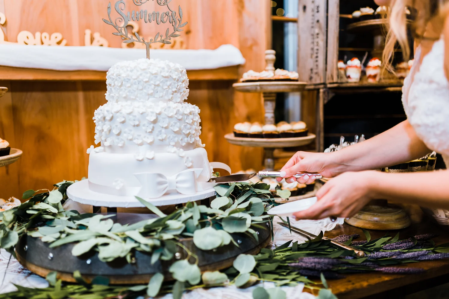 Bride and Groom cut their cake - wedding cake inspo