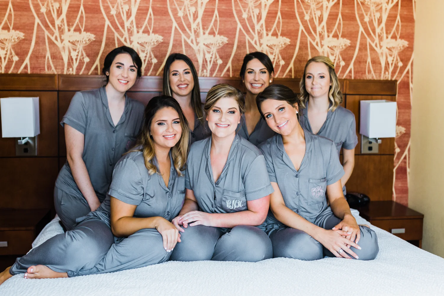 bride and her bridesmaids with matching monogrammed pajamas - Maryland wedding venues - Frederick MD wedding photographer and videographer