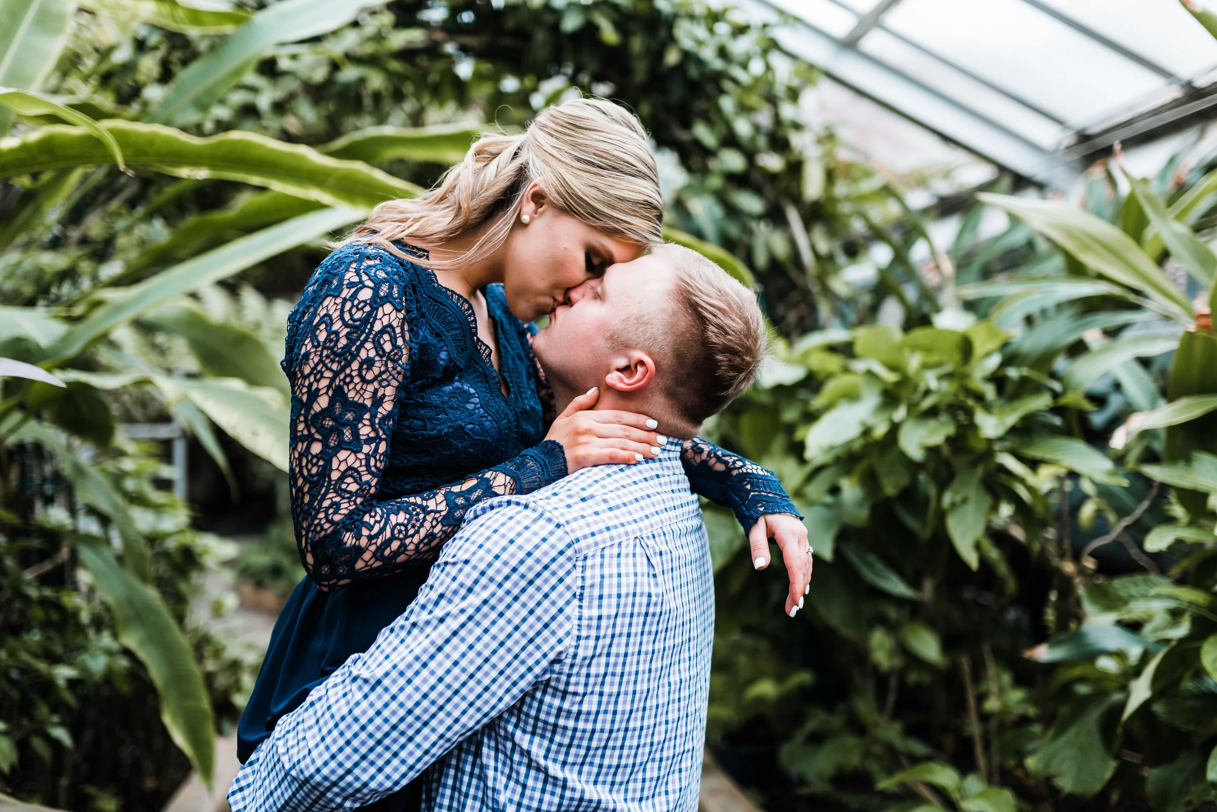 engagement session with beautiful greenery at conservatory in Baltimore MD - best rated husband and wife photography team in Maryland