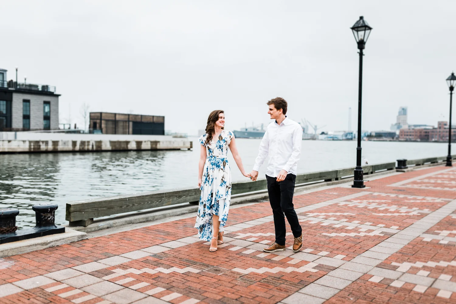couple walking together during Fells Point engagement session