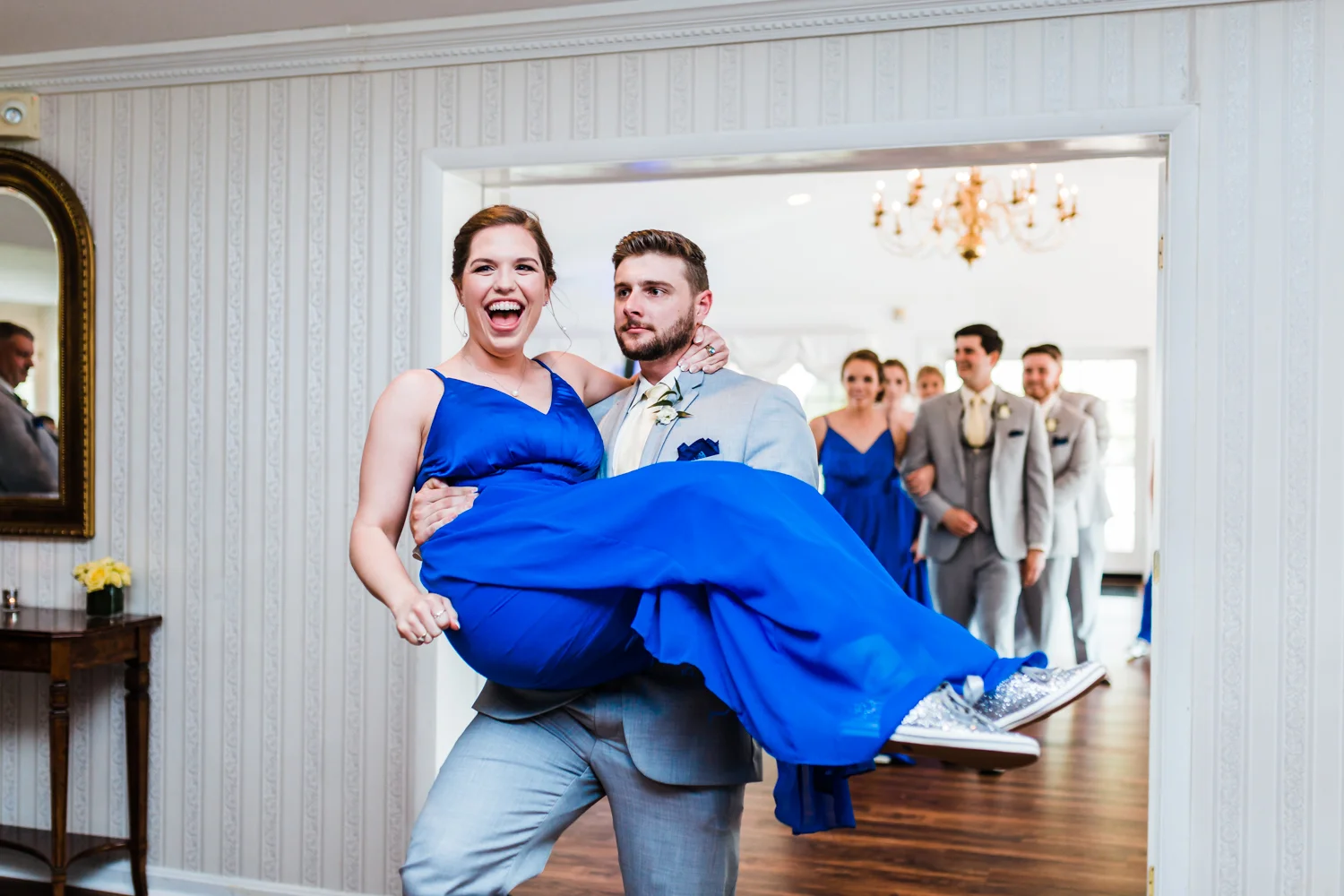 bridesmaid and grooms man being introduced to reception - top candid photographer in Maryland