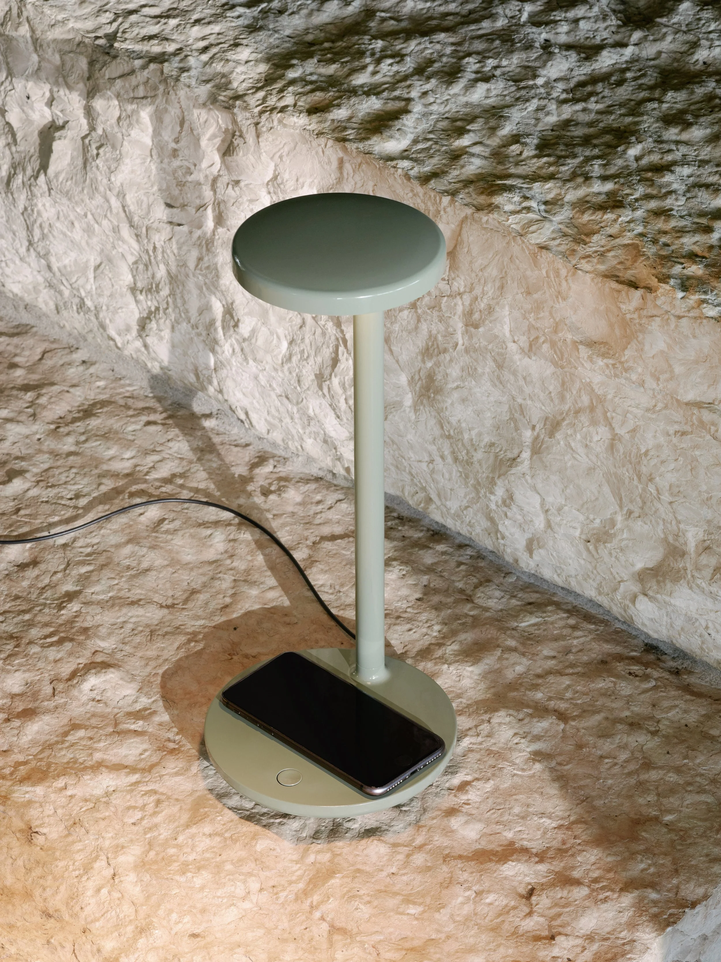 Flos introduces Oblique Qi - a compact table lamp with wireless charging base