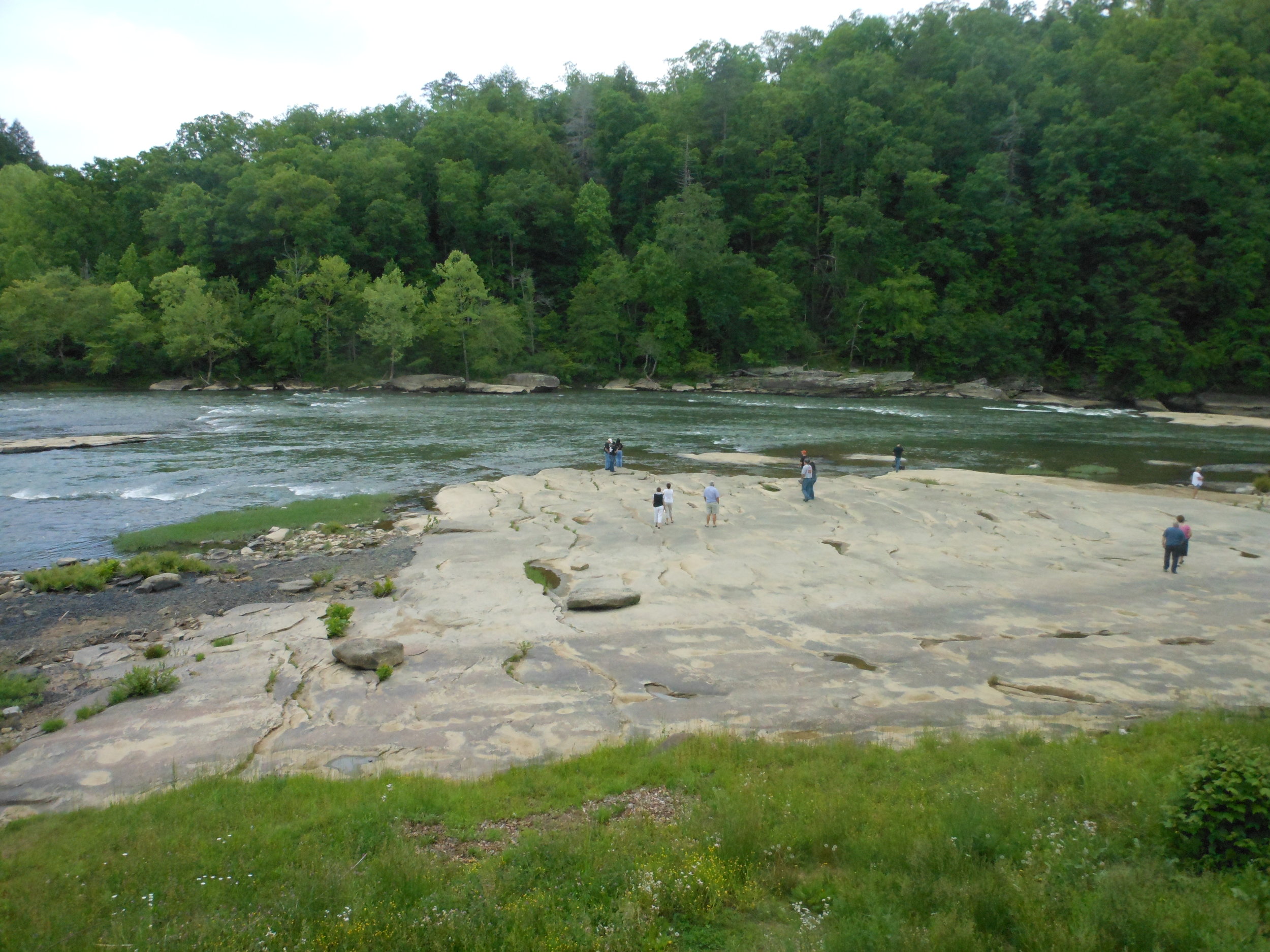 Just above the falls, there are plenty of places to walk out near the river which appears quite calm at that point.