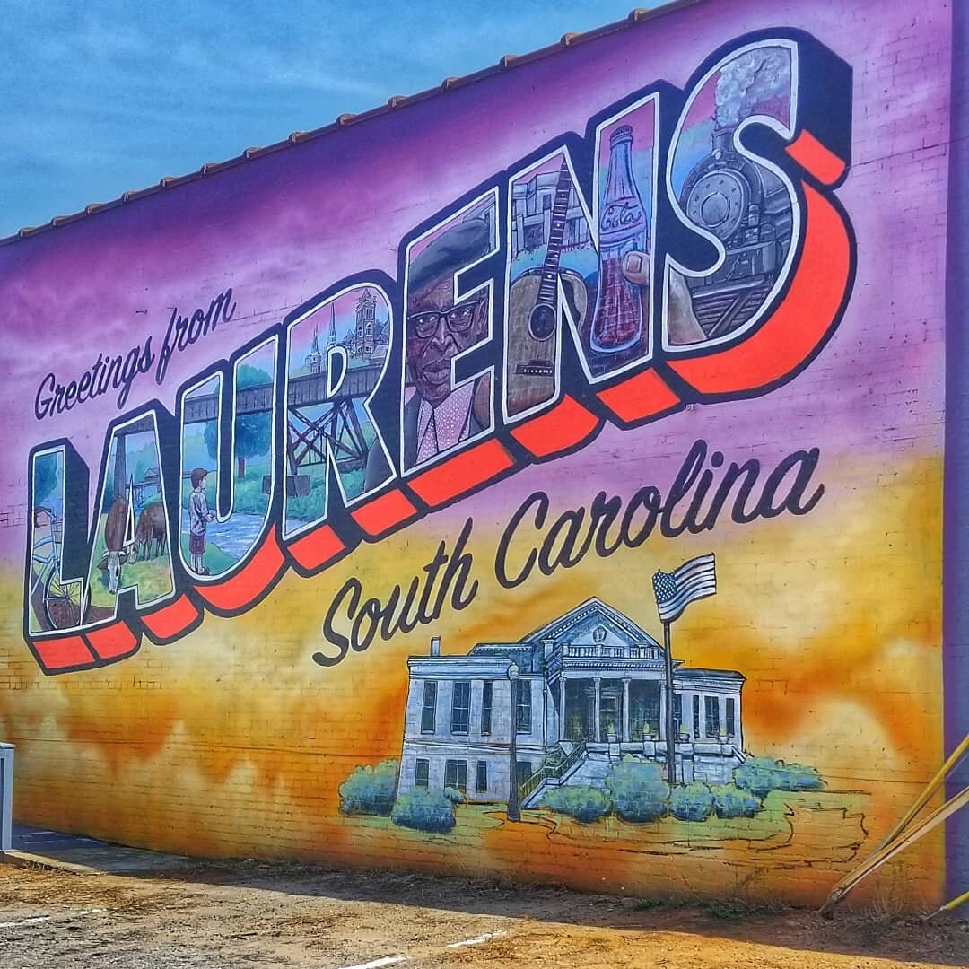 Downtown Laurens, SC is bustling with activity these days with several new businesses opening up in and around the Courthouse Square. 

We recently made a stop there to see the new postcard mural and have lunch at Tacos, blah. Blah , blah. We visited