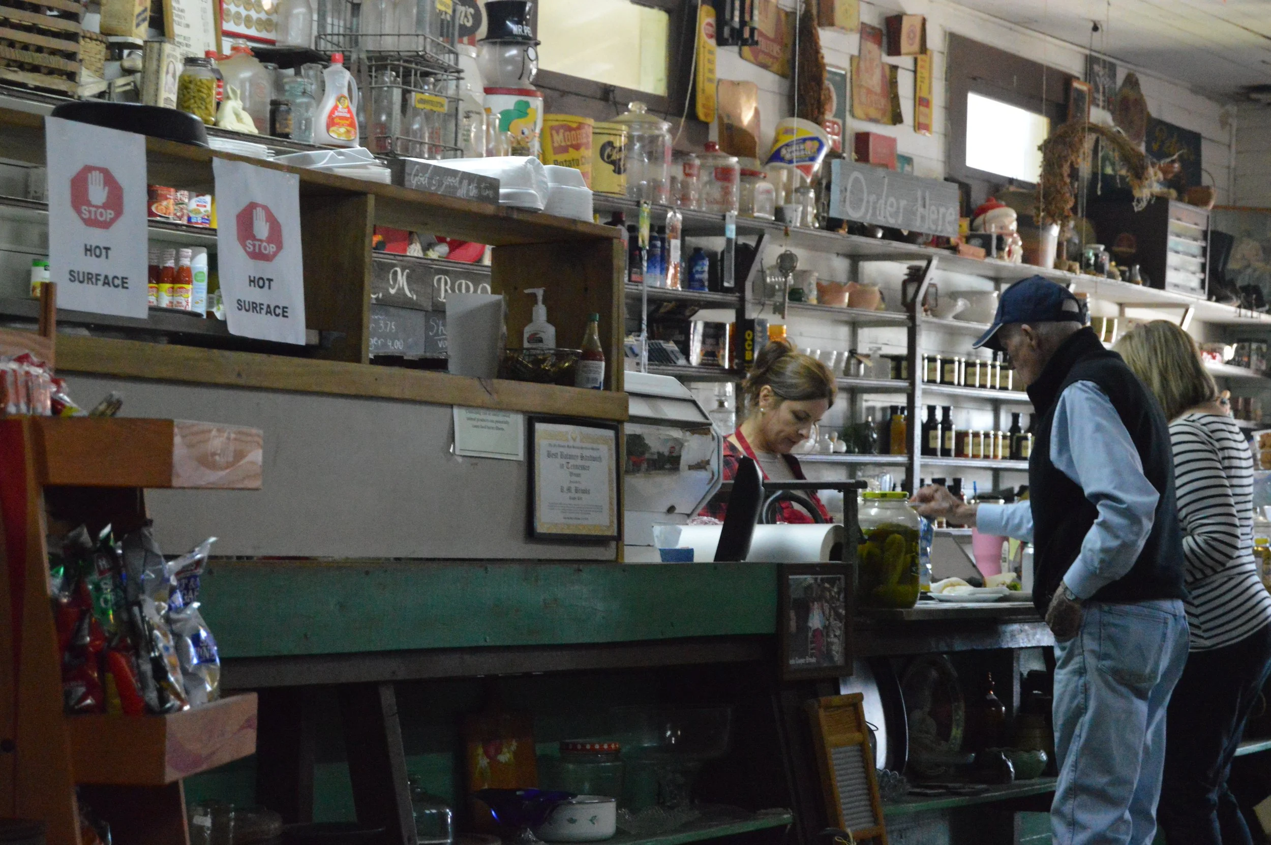 Customers place an order at the counter of an old general store in East Tennessee