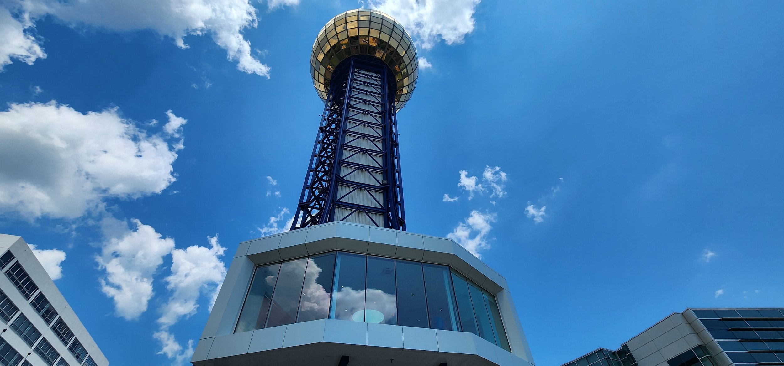 a tall blue steel structure with a golden sphere on top called the Sunsphere was the centerpiece of the 1982 Worlds Fair in Knoxville
