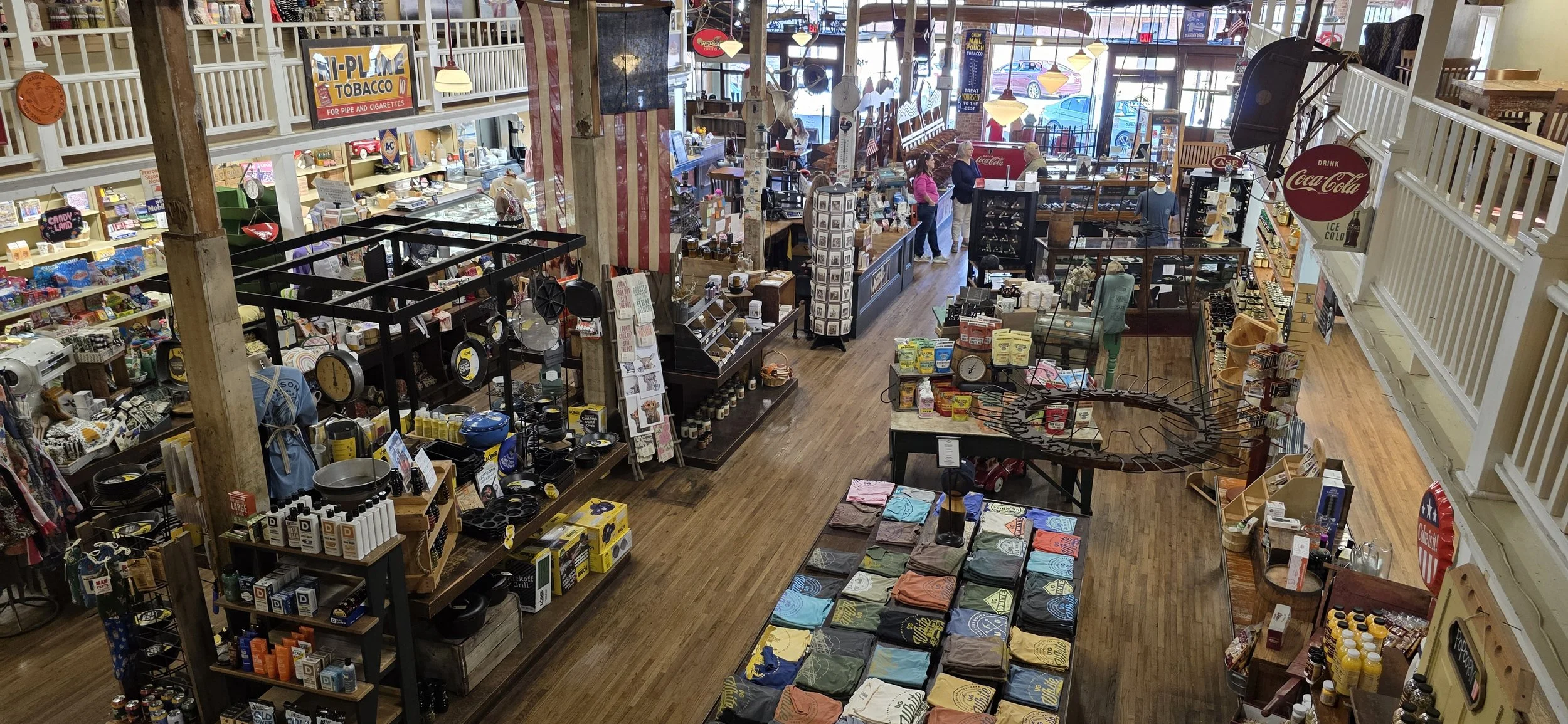 big open room of a general store with second floor surrounding it.