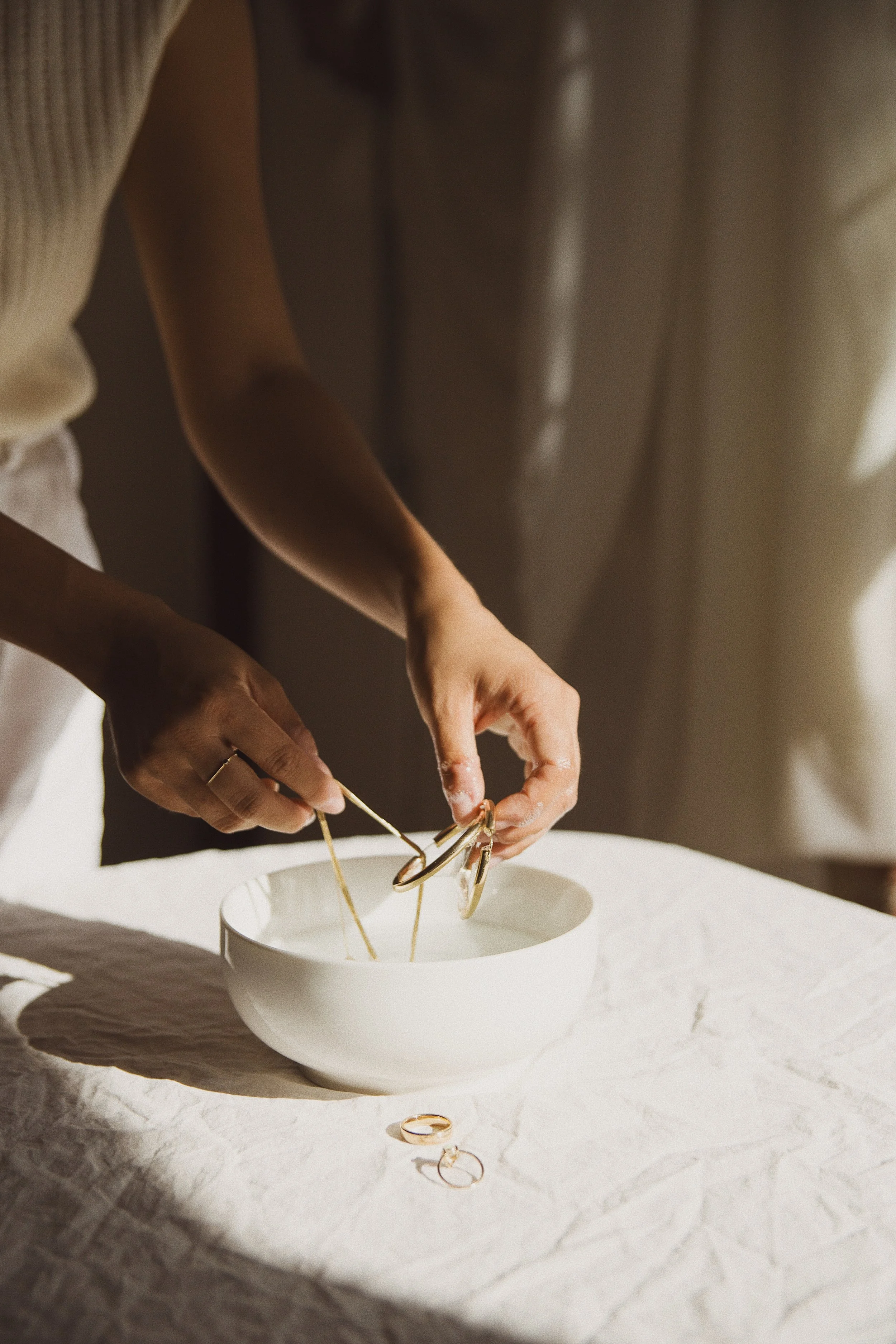 Dip your jewelry in the solution and even brush with a soft bristled tooth brush to get into the nooks and crannies. You may also rub the jewelry between your fingers for slight friction if you don't have a brush. 