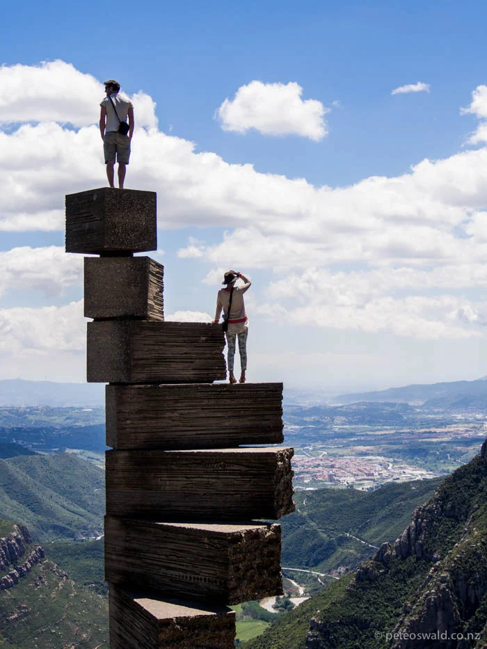Will and Harry scale a sculpture at a Monastery at Montserrat, 1236m above the valley floor