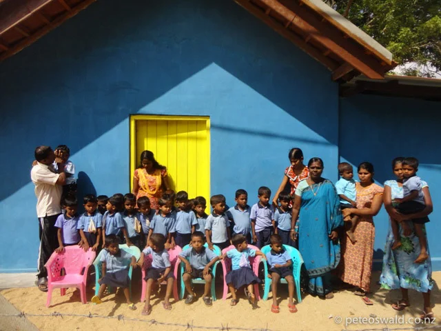 Students, teachers and some parents outside the newly renovated school