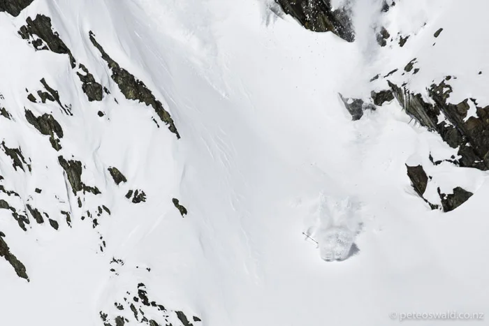 Pow stomp landing from a narrow chute. Photo: Jakob Schweighofer