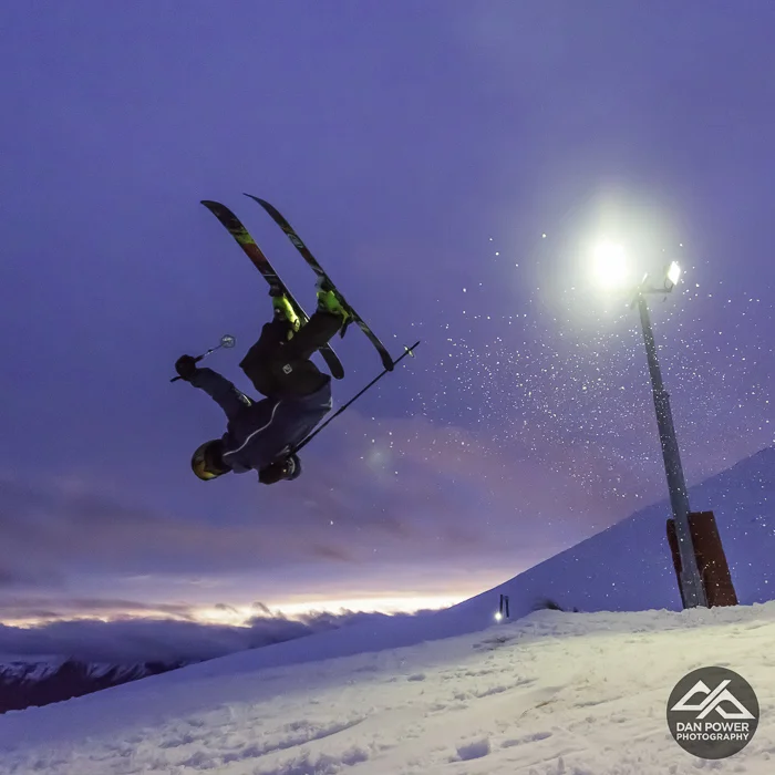 Getting upside down with sunset under lights at Coronet Peak. Photo: Dan Power