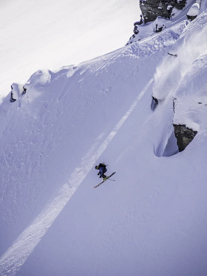 Taking a small cliff long out the bottom of some Treble Cone backcountry. Photo: Lukas Zögernitz