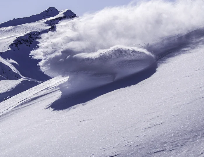 Powder cloud! Michael finding us the goods with Black Peak in the background. Photo: Lukas Zögernitz