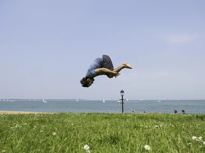 Front flip on the grass on Cowes Green, Isle of Wight UK. Photo: Sophie Stevens