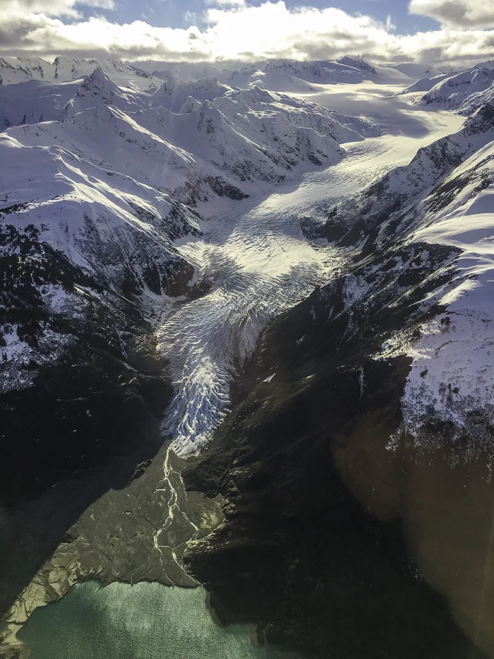 A view from the flight out of Haines of a massive glacier that terminates in the sea… or used to