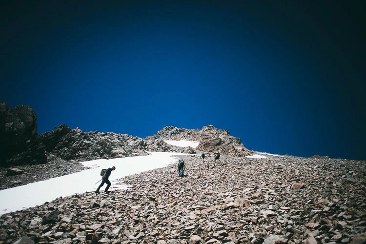 Approaching the summit. Rocky scree made a tricky climb. Photo: Tom Powell