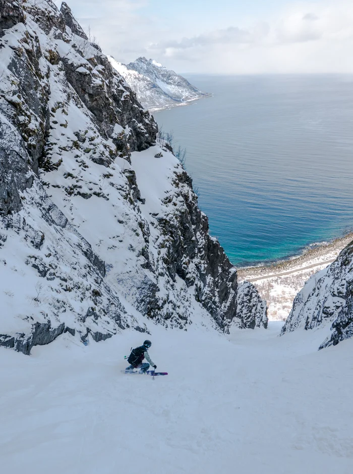 Soph skiing to the sea at Senja. Photo: Pete Oswald
