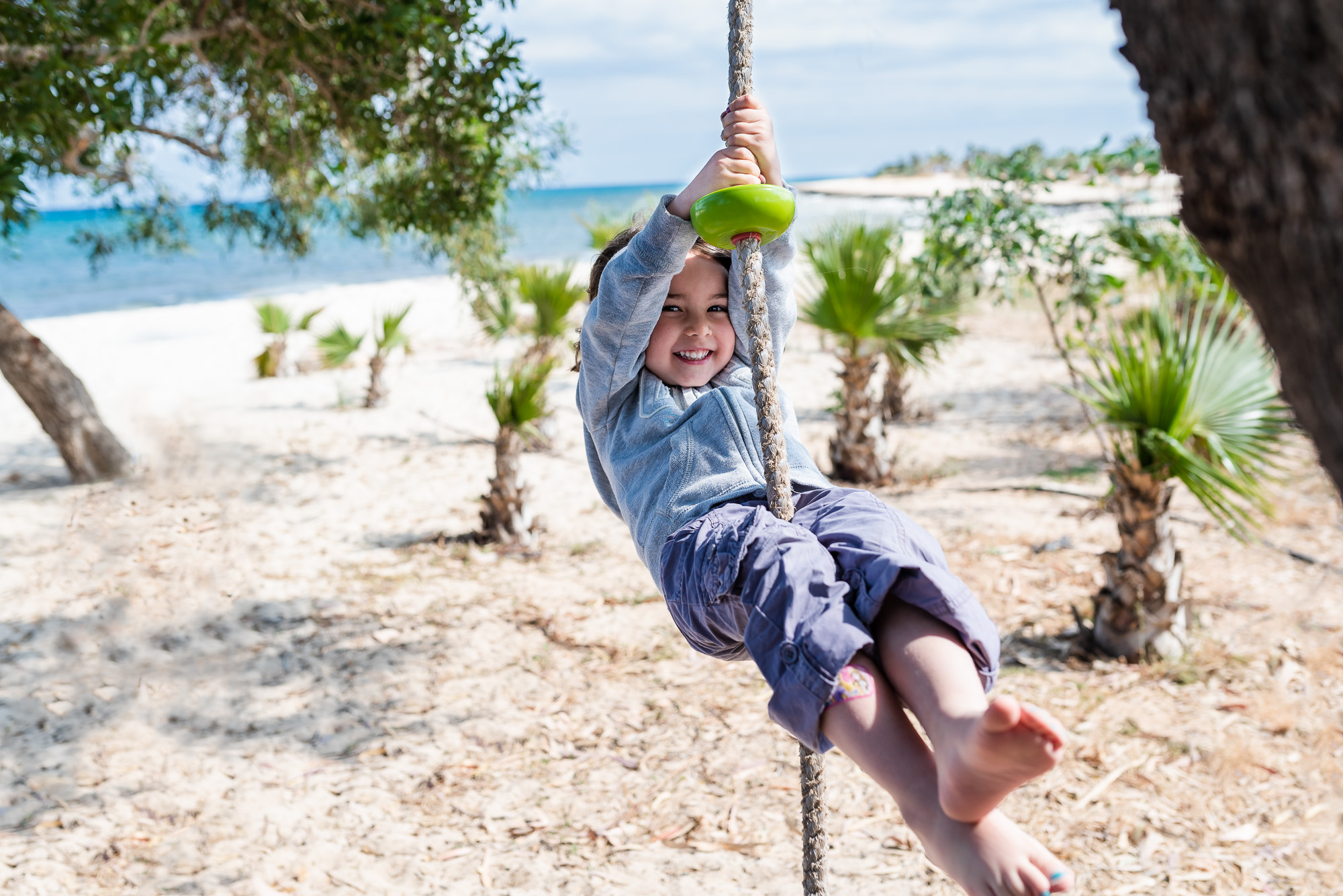 swinging in the air on the beach.jpg