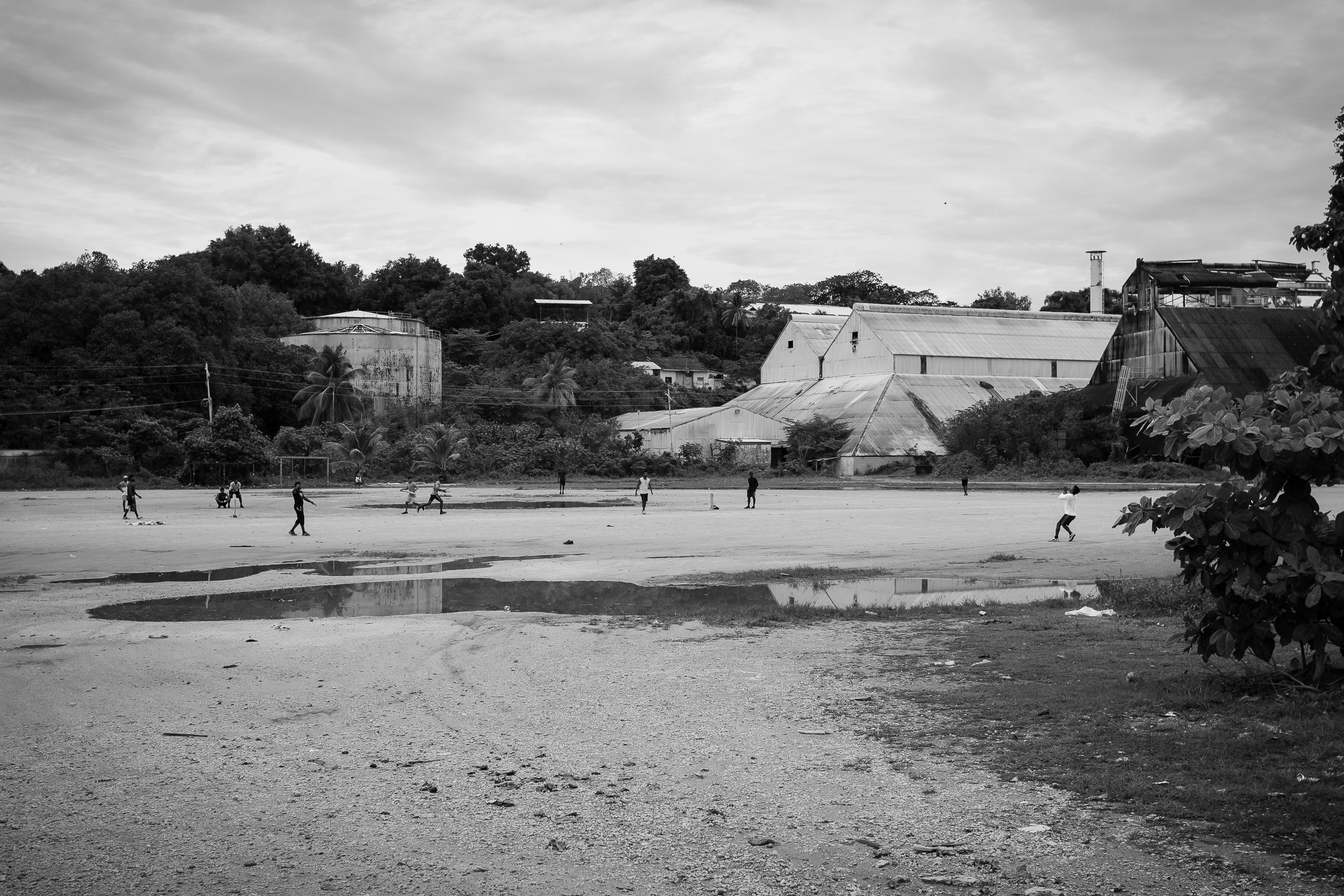 Tamil refugees play a game of cricket in Aiwo district. Refugees still held in detention can be taken out of the centres into the community, however are under constant watch from immigration officials.