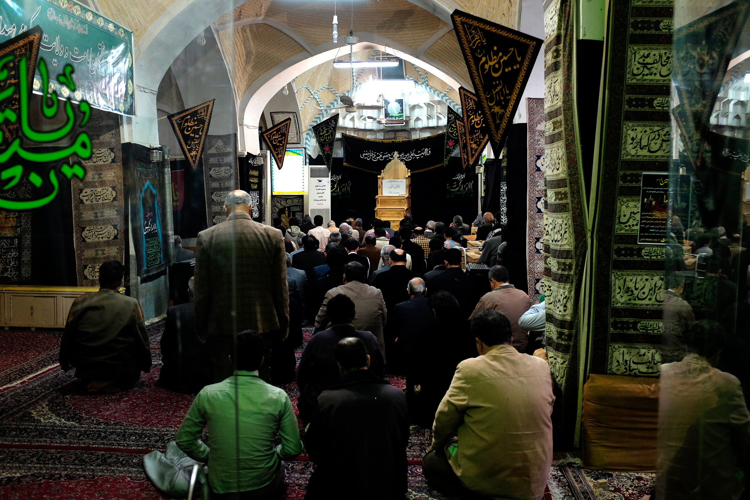 Men gather for prayer in Kashan.