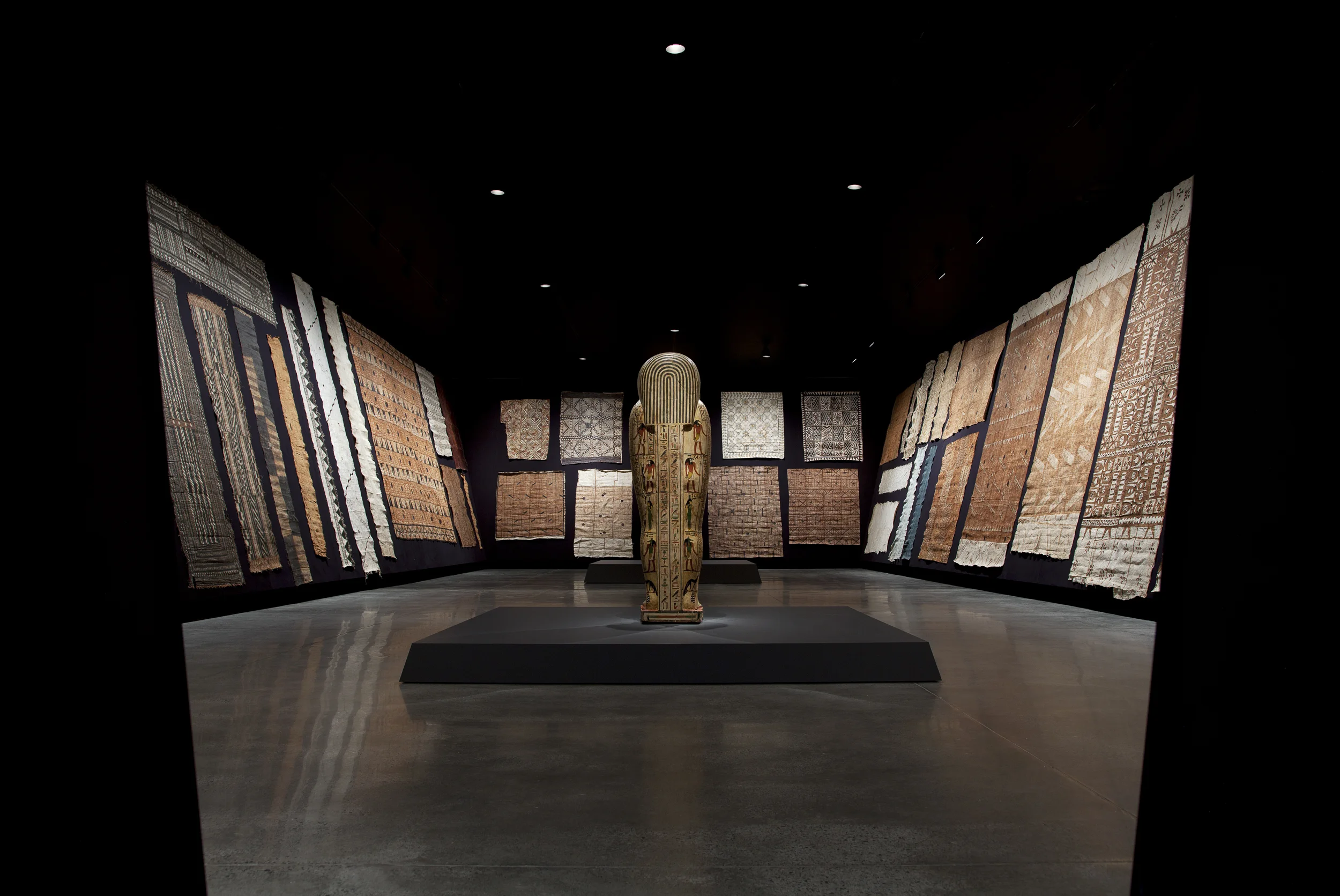The Tasmanian Museum and Art Gallery's Barkcloth Collection from Fiji, Papua New Guinea, Samoa, Solomon Islands, Tahiti, Tonga, Vanuatu, Possibly Melanesia and Futuna, with: Coffin of Iret-Heru-ru Egypt, late 26th Dynasty, c. 600–525 BCE Wood, gesso, pigment 172 x 54 x 42.5 cm As a part of the Theatre of the World exhibition at Mona.