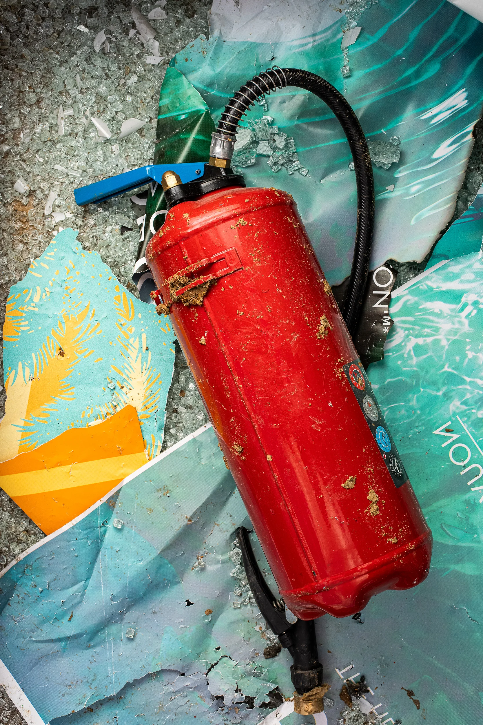 Fire extinguisher, torn posters & shattered glass, 2018