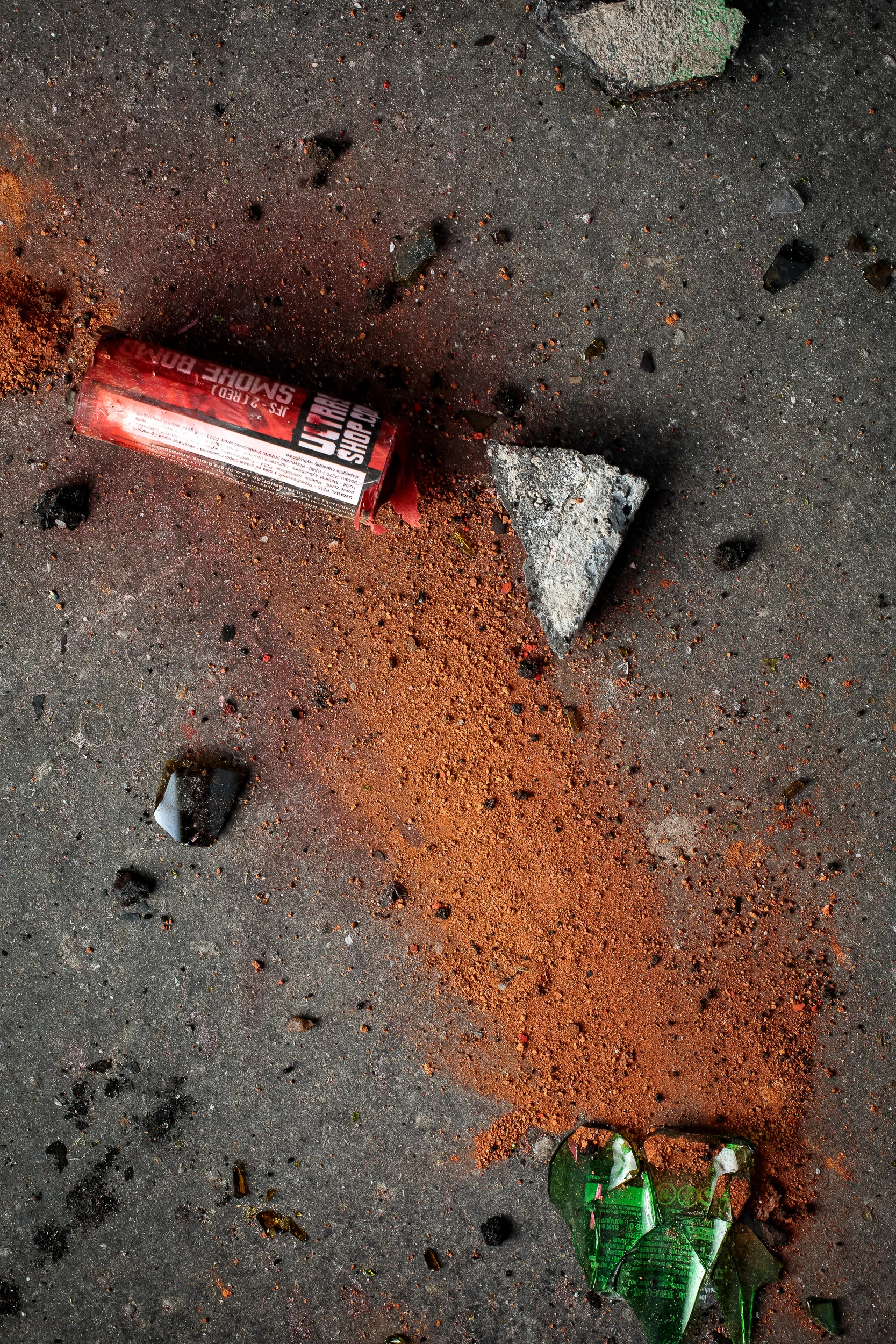 Cement blocks, red smoke bomb and broken bottles, 2018