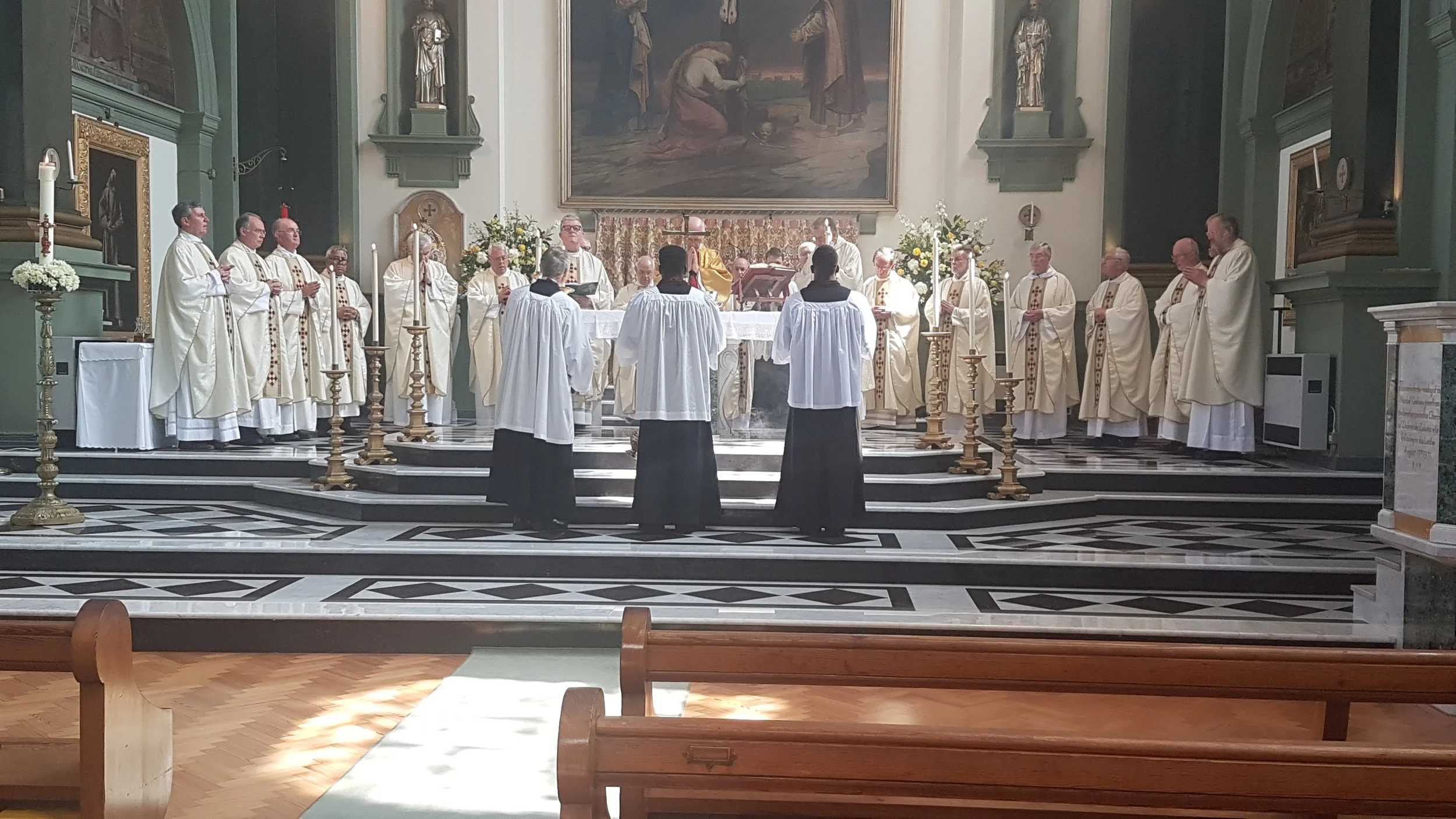 Jubilee mass priests at altar.jpg