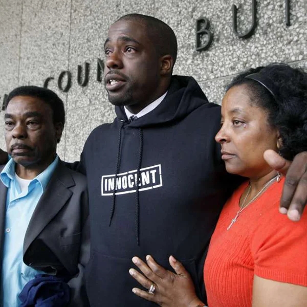 Brian Banks, center, with his mother, Leomia Myers, and father, Jonathan Banks, outside court after his rape conviction was dismissed in Long Beach, Calif., in May 2012 (Photo Credit: AP)