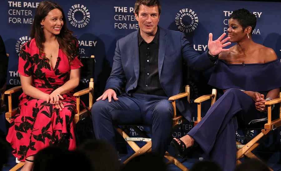 Actress Afton Williamson, former star of “The Rookie,” pictured with Melissa O'Neil and Nathan Fillion, quit her job and claimed sexual misconduct on set (Credit: Dimitrios Kambouris/Getty)