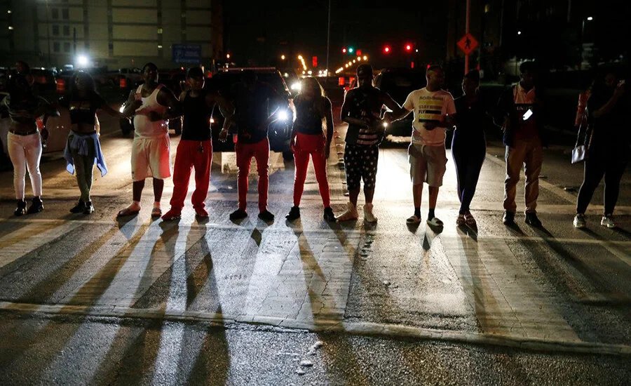 Protesters angry over the sentence Amber Guyger received stand together in protest (Credit: Vernon Bryant / Dallas Morning News)