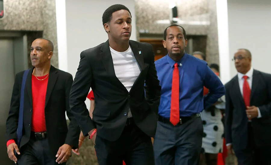 (Middle) Brandt Jean, brother of Botham Jean, who offered forgiveness and compassion to Amber Guyger (Credit: Associated Press)