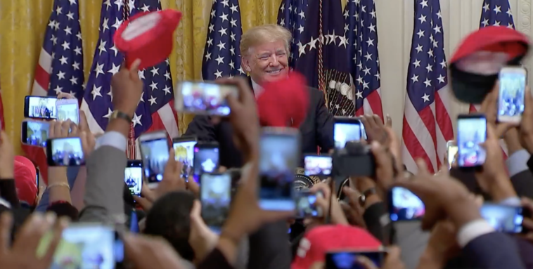 Trump with young black leaders in 2018. The support is just as enthusiastic a year later (Credit: Getty)