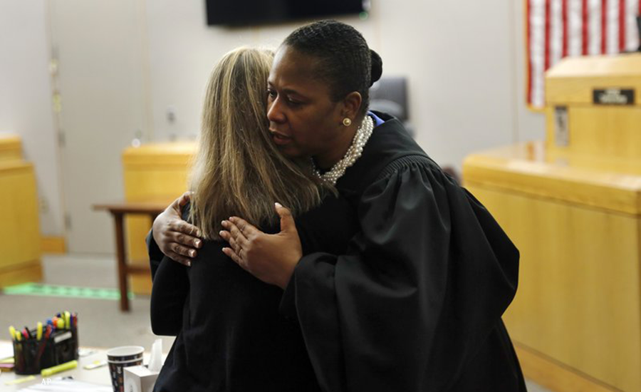 Judge Tammy Kemp gives Amber Guyger a hug after the trial is over. (Tom Fox/The Dallas Morning News via AP, Pool)