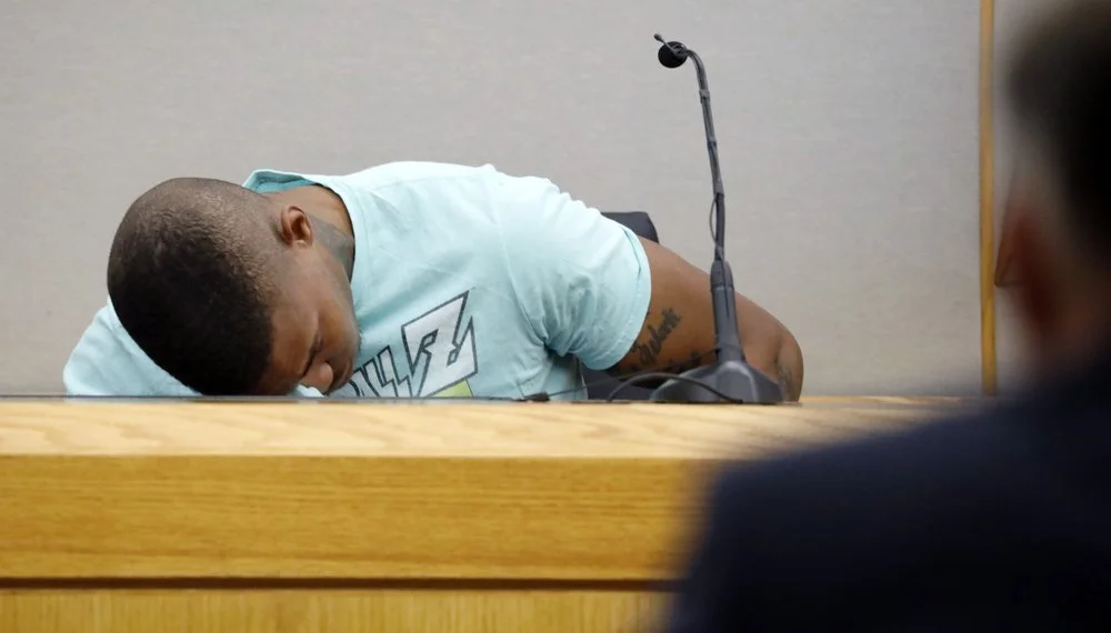 Joshua Brown broke down on the witness stand, overcome with emotion, while testifying in the Amber Guyger murder trial (Credit: Associated Press)