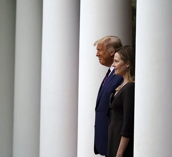 President Donald Trump walks with Judge Amy Coney Barrett to a news  conference to announce Barrett as his nominee to the Supreme Court, in  the Rose Garden at the White House, Saturday, Sept. 26, 2020, in  Washington. (AP Photo/Alex Brandon)