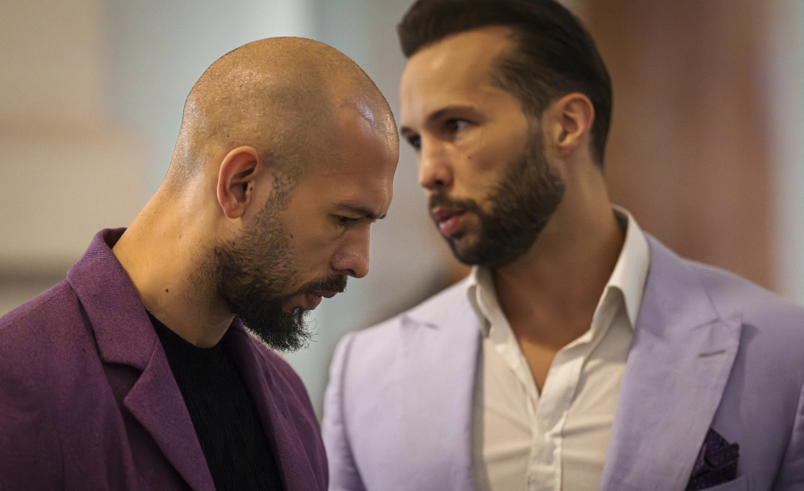 Andrew Tate, left, listens to his brother Tristan, right, at the Court of Appeals building in Bucharest, Romania.