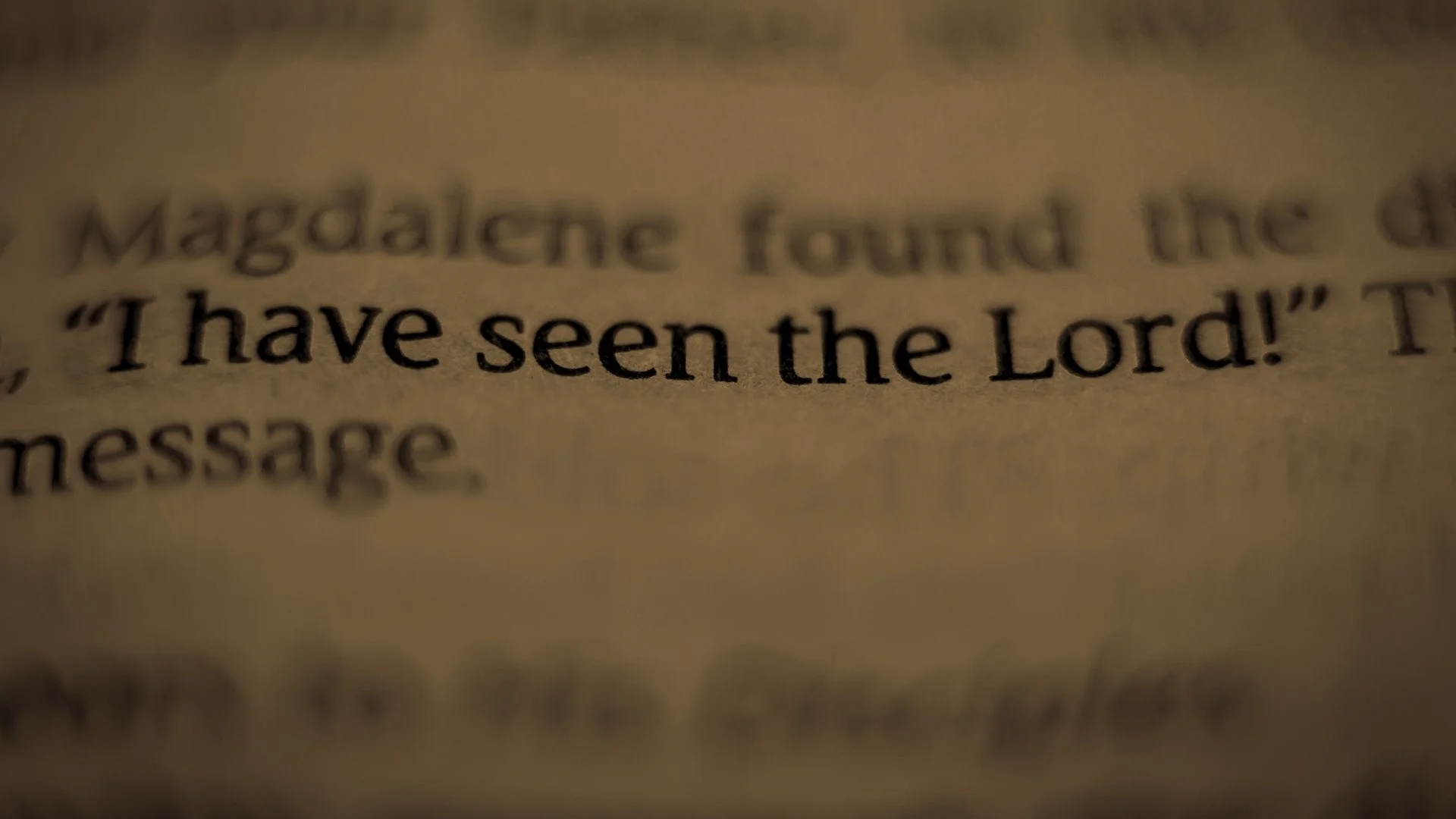 Close-up of a printed Bible page with the words “I have seen the Lord!” in focus.